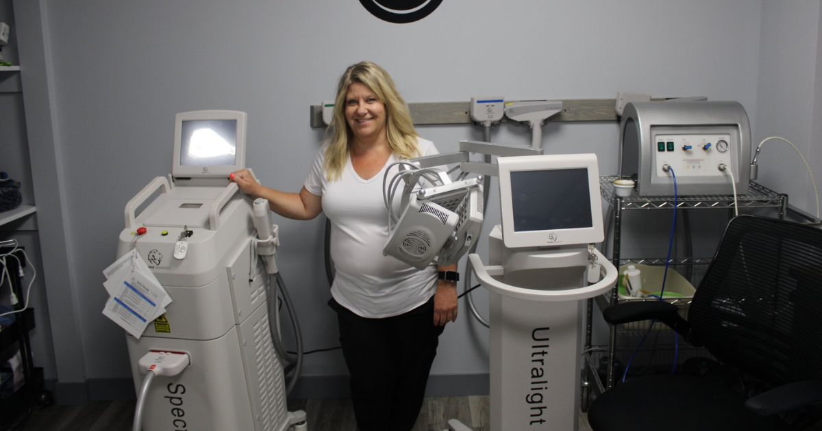 Amy Bassett with esthetics and laser equipment at Harmony Healing Arts in Stuart, Iowa
